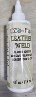 Leather Weld by Eco-Flo. This is a water-based adhesive. Used to bond two pieces of leather along a stitch line. This will occur either before holes are made with stitching chisels, *or* after that step and before stitching occurs